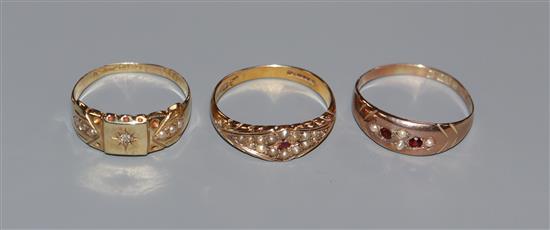 Two early 20th century 15ct gold and gem set rings and a 9ct gold and gem set ring.